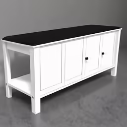 a white buffet with black top and drawers