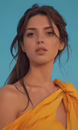 a young woman in an orange dress posing for the camera