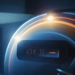 an alarm clock that is sitting in front of the camera