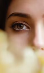 a close - up view of a girl with beautiful eyelashes