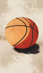 a red and yellow ball sitting in sand