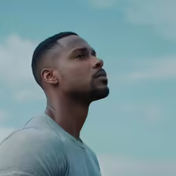 a man is looking up in the sky