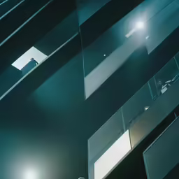 a man is walking down the stairs in an apartment building