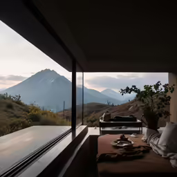 a bedroom has an open window to take in the view