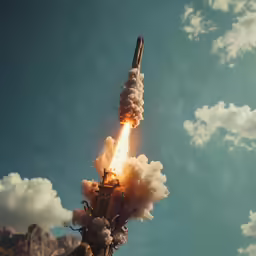 someone holds a rocket like object while it is being launched