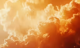 a large amount of clouds are shown in this orange and yellow photo