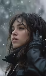 a woman in black coat looking at something