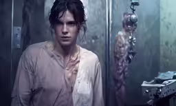 the girl is staring at something in a hospital