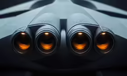 two yellow lights shine on top of some pipes