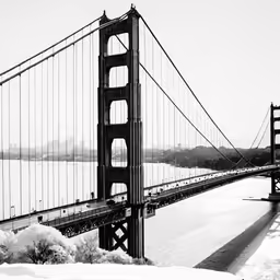 a large bridge is spanning over a body of water