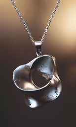 two silver pieces are sitting on a chain