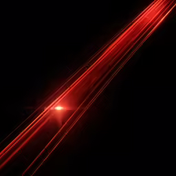 an aerial shot of a road at night