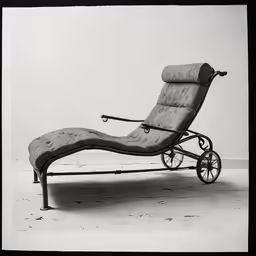 an old photo shows an empty reclining chair