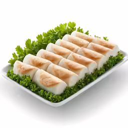 small trays of meat with green garnish are on display