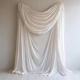 a white draped cloth covered in white cloth