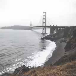 a large bridge spanning over a calm ocean