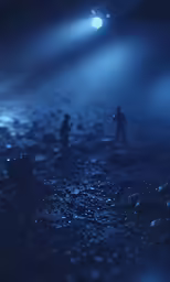 two people standing on rocks beneath foggy lights