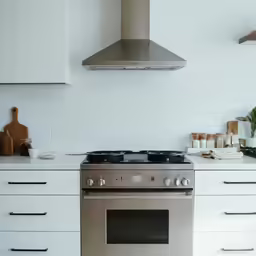 a stove top oven sitting in a kitchen