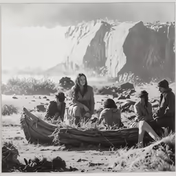 old fashion women sitting in a desert setting
