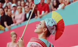 a girl with an umbrella and red stripes is holding a staff