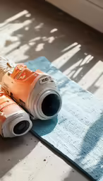 an orange toy gun laying on a blue towel