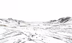 the skier is moving across the snow - covered mountains