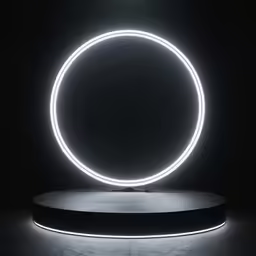a light up circle in the middle of a dimly lit room
