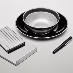 a cup and saucer sit on a table