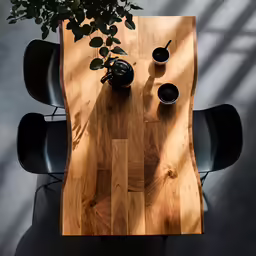 a wooden table top with potted plants on it