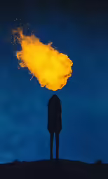 a person holding a large yellow substance in their head