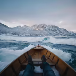 a person on a wooden boat in the water