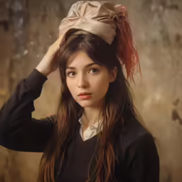a girl with a hat on her head