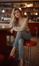 a woman is sitting on the red chair posing