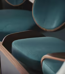 close up of green colored seats in a row