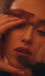 a woman putting her hands on her face
