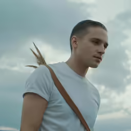 the man with his hair pulled back