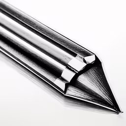 a close up of two black and white pens with one pointed down