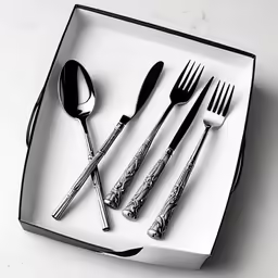 a set of six silver plated flatware in a box