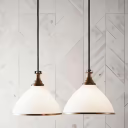 two white lights hanging from black metal cord with marble background