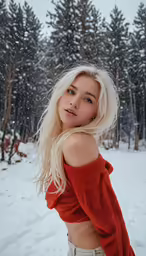 a woman standing in the snow with her hands on her hips