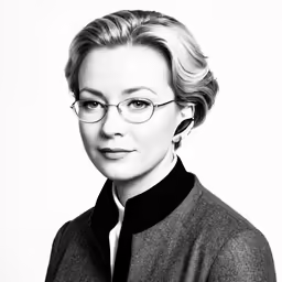 black and white photo of woman wearing glasses