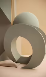 two circular sculptures, one with a single disc and the other a cone