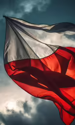 a close up of a large red and white flag