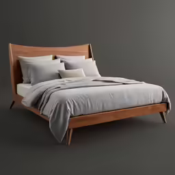 a bed with a grey blanket and two pillows