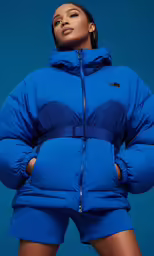 the jacket in blue features two layers of padded and zipped