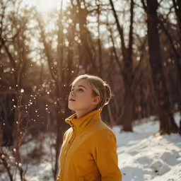 there is a woman that is standing in the snow