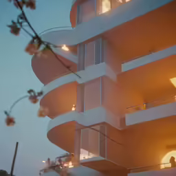 an image of a building with lights and flowers