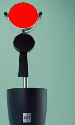 a black and red item on a green background