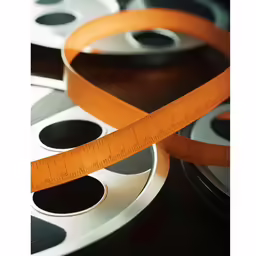 some film reels with a tape around them