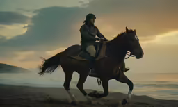 a man is riding his horse on the beach